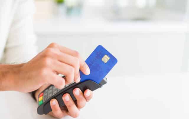 Image of a man buying on a POS terminal