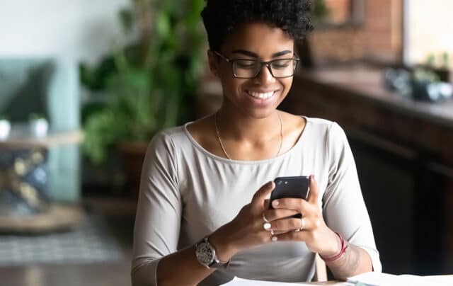 Woman changing her password on her phone